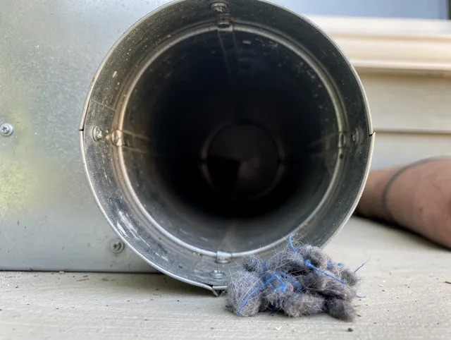 South Euclid Dryer Vent Cleaning technician using specialized equipment to clear severe dryer vent blockage in South Euclid